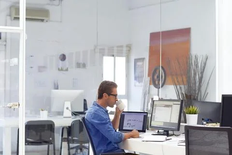 Office, computer and man with coffee for finance review, insurance policy a.. Stock Photos