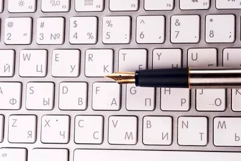 Office computer and pen. Top view with copy space. Stock Photos