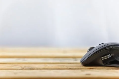 Office concept. Close up head mouse on wood table and white background with c Stock Photos