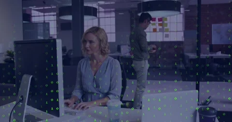 Office co?workers typing on computer and arranging sticky notes in tech with Stock Footage 330403351