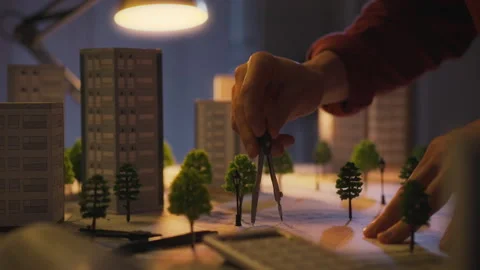Office. A design professional uses a compass to take measurements in an arch Stock Footage 270427686