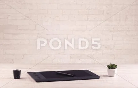 Office desk closeup with white brick wall Stock Photos