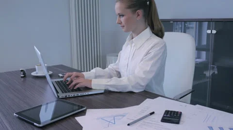 Office desk cluttered with paperwork Stock Footage 25128775