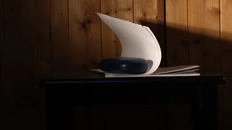 Office desk fan blowing notepad paper Stock-Footage 252592518