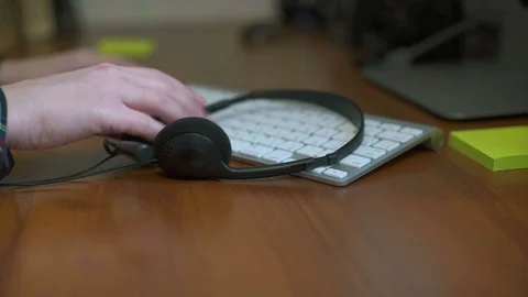 Office desk with headset and pc. Call center support table Stock Footage 114752048