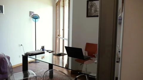 Office desk with laptop and documents Stock Footage 86353728