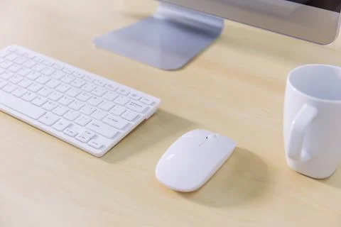 Office desk table with computer and coffee cup. Top view Stock Photos