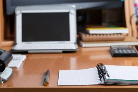 Office desk table with computer, calculator, supplies. Copy space for text Stock Photos