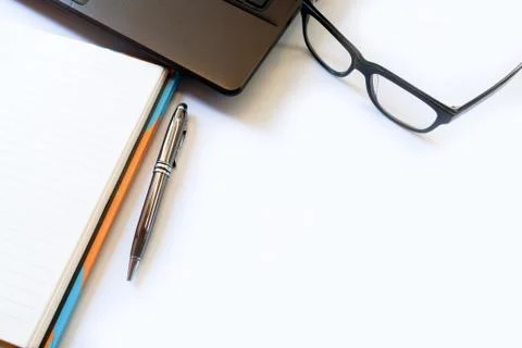Office desk table with computer, laptop, glasses ,supplies, notebook and pe.. Stock Photos