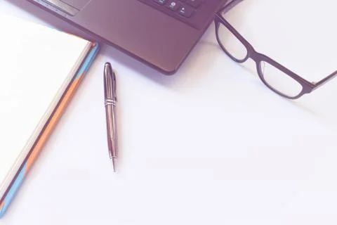 Office desk table with computer, laptop, glasses ,supplies, notebook and pe.. Stock Photos