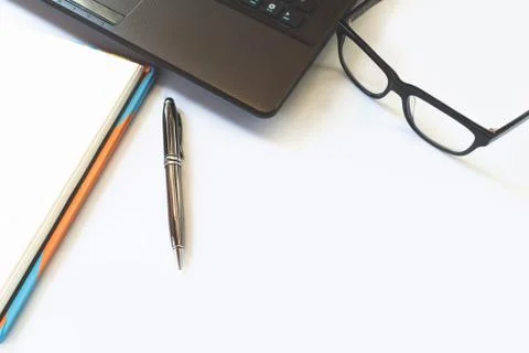Office desk table with computer, laptop, glasses ,supplies, notebook and pe.. Stock Photos