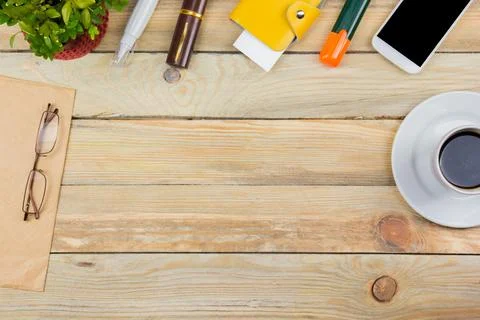 Office desk table with computer, pen and a cup of coffee, lot of things. To.. Stock Photos