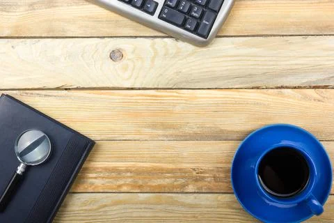 Office desk table with computer, pen and a cup of coffee, lot of things. Top  Stock Photos