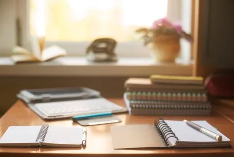 Office desk table with computer, supplies, flower Stock Photos