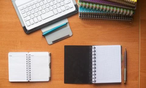 Office desk table with computer, supplies, flower Stock Photos