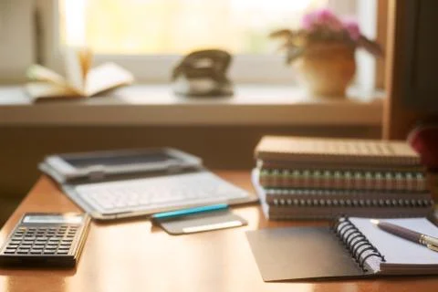 Office desk table with computer, supplies, flower Foto stock