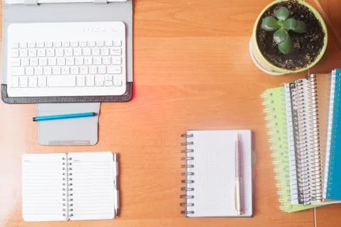 Office desk table with computer, supplies, flower Stock Photos