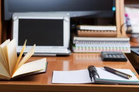 Office desk table with computer, supplies. Stock Photos