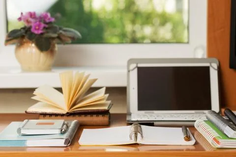 Office desk table with computer, supplies. Stock Photos