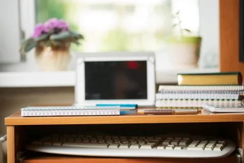 Office desk table with computer, supplies. Stock Photos