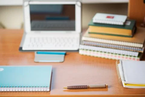 Office desk table with computer, supplies. Stock Photos