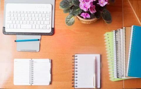 Office desk table with computer, supplies, flower Stock Photos
