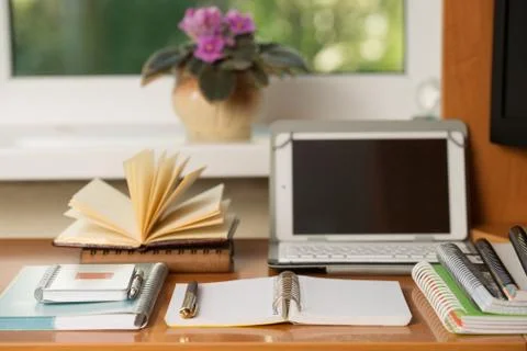 Office desk table with computer, supplies, flower Stock Photos
