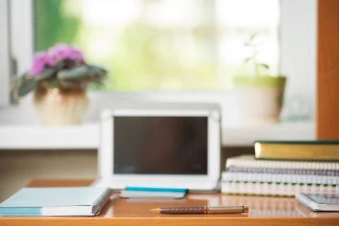 Office desk table with computer, supplies, flower Stock Photos