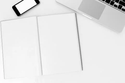 Office desk table with labtop computer,blank magazinesmart phone and coffee cup Stock Photos
