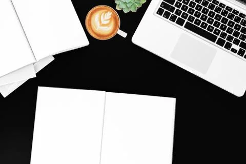 Office desk table with labtop computer,blank magazinesmart phone and coffee cup Foto stock