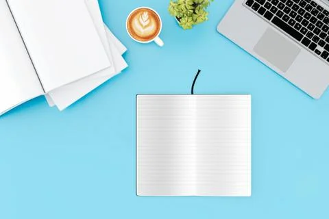 Office desk table with labtop computer,blank magazinesmart phone and coffee cup Foto stock