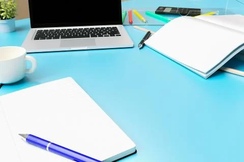 Office desk table with labtop computer,blank magazinesmart phone and coffee cup Stock Photos