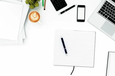 Office desk table with labtop computer,blank magazine smart phone and coffee cup Stock Photos