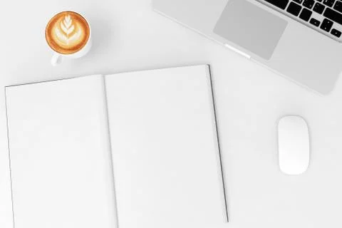 Office desk table with labtop computer,blank magazinesmart phone and coffee cup Stock Photos