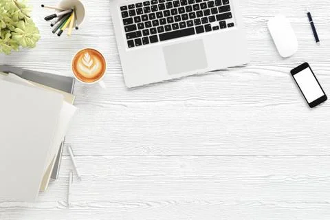 Office desk table with labtop computer,blank magazine smart phone and coffee cup Stock Photos
