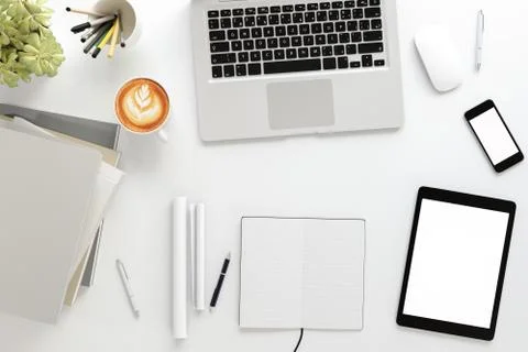 Office desk table with labtop computer,blank magazine smart phone and coffee cup Stock Photos
