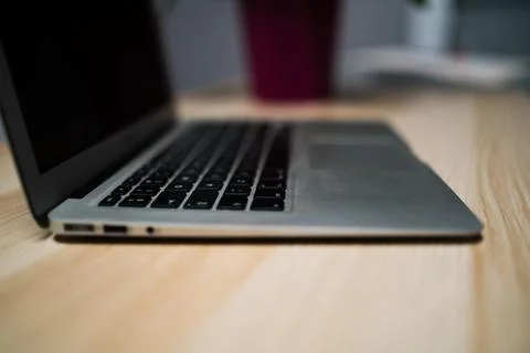 Office desk table with laptop computer and flower. Top view with copy space Fotos Stock
