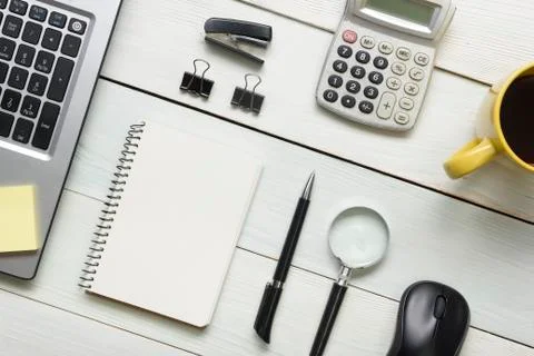 Office desk table with supplies and coffee cup. Top view. Copy space for text Stock Photos