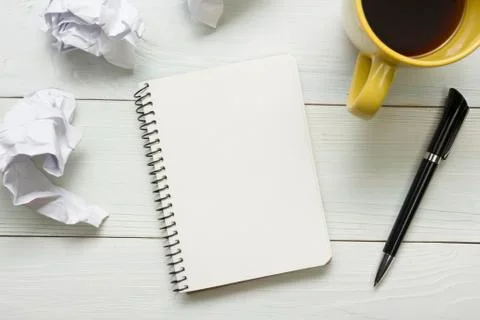Office desk table with supplies and coffee cup. Top view. Copy space for text 库存照片