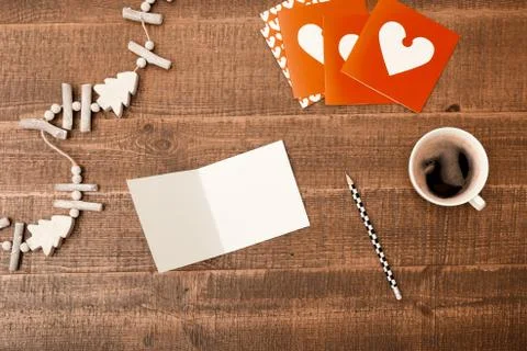 Office desk table. Top view with blank greeting card, pencil, christmas decor Stock Photos