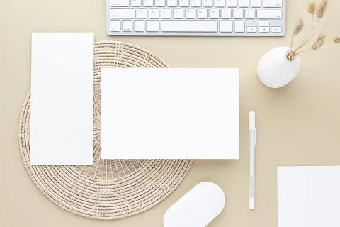 Office desk table top view. Ceramic vase with reed grass and office supply, B Stock Photos