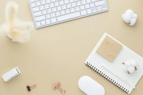 Office desk table top view. Ceramic vase with reed grass and office supply, B Stock Photos