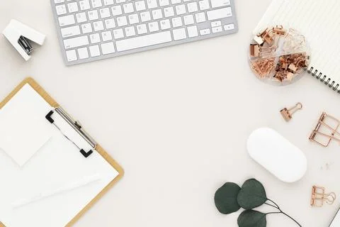 Office desk table top view with office supply, beige table with copy space, b Stock Photos
