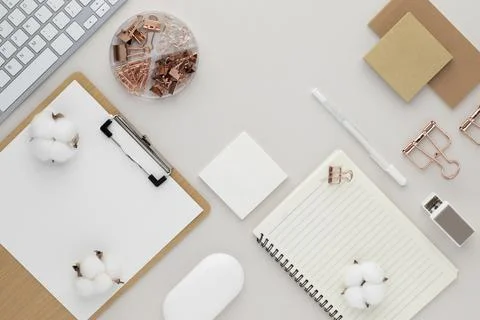 Office desk table top view with office supply, beige table with copy space, b Stock Photos