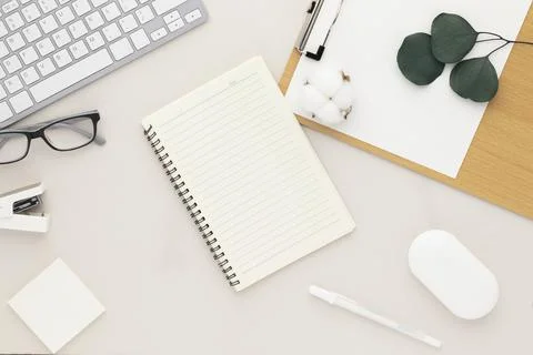 Office desk table top view with office supply, beige table with copy space, b Stock Photos