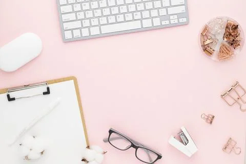 Office desk table top view with office supply, pink table with copy space, pi Stock Photos