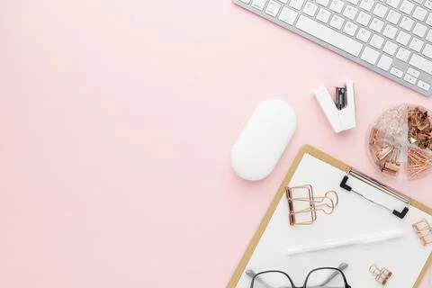 Office desk table top view with office supply, pink table with copy space, pi Stock Photos