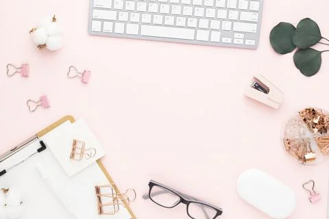 Office desk table top view with office supply, pink table with copy space, pi Stock Photos