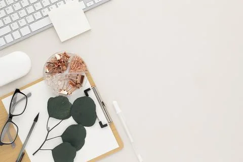 Office desk table top view with office supply, beige table with copy space, b Stock Photos