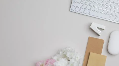 Office desk table top view with office supply, beige table with copy space, b Stock Photos